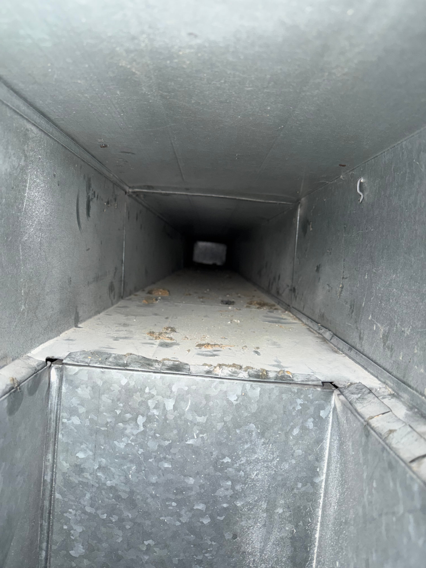 Air Duct Cleaning before — Wood duct interior